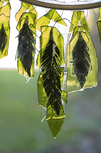 feather-like inclusion in recycled glass